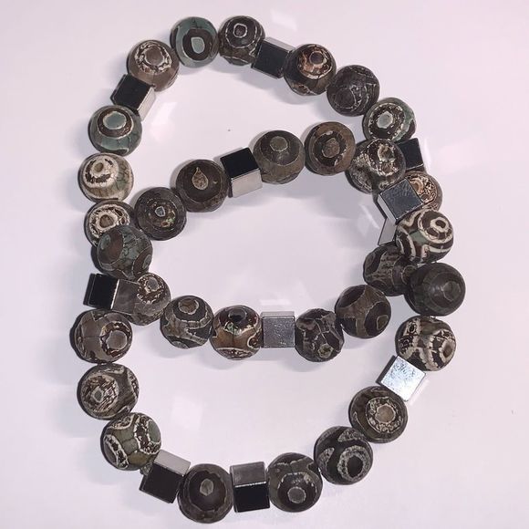 Pair of Tibetan dzi stretch bracelets with stainless steel accent beads - Picture 1 of 4